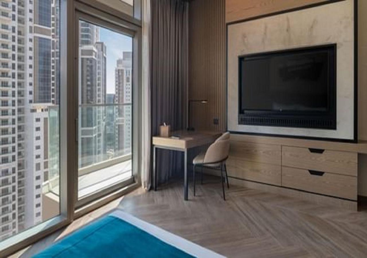 โรงแรมพาราเมาท์ มิดทาวน์ ดูไบ ภายนอก รูปภาพ A bedroom at the hotel